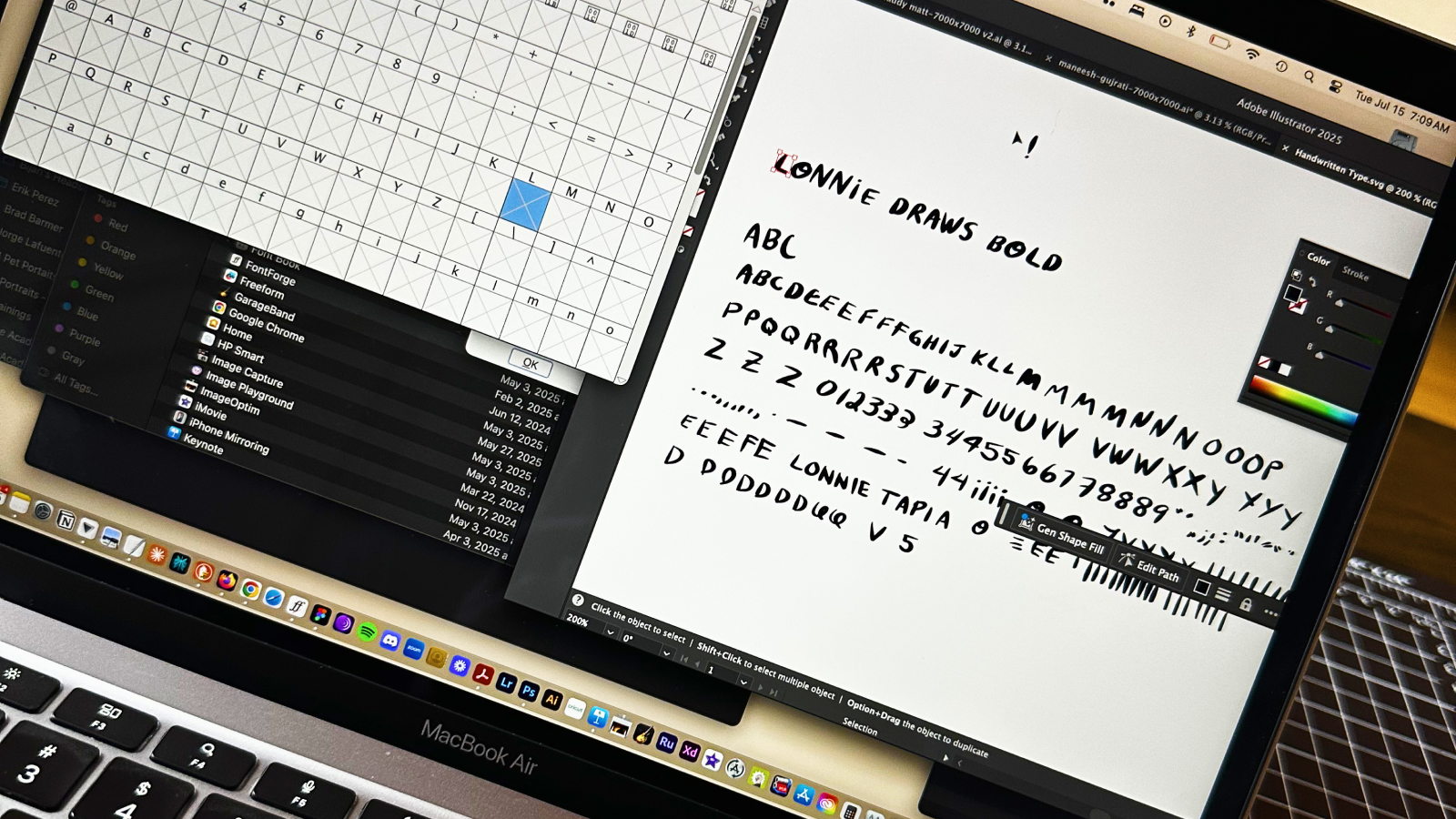 Early hand drawn sketches of the Lonnie Draws Bold letterforms next to the font software mid-build
